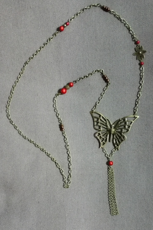 Z0004 - Sautoir bronze papillon, décor et perles rouges
